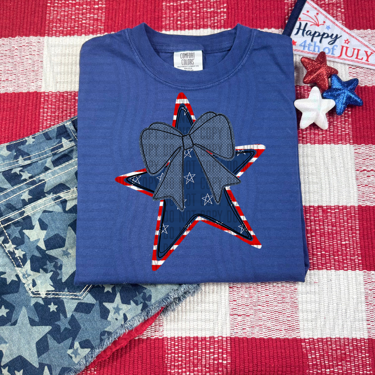blue star with red and white outline and blue bow (caplinger) DTF Transfer