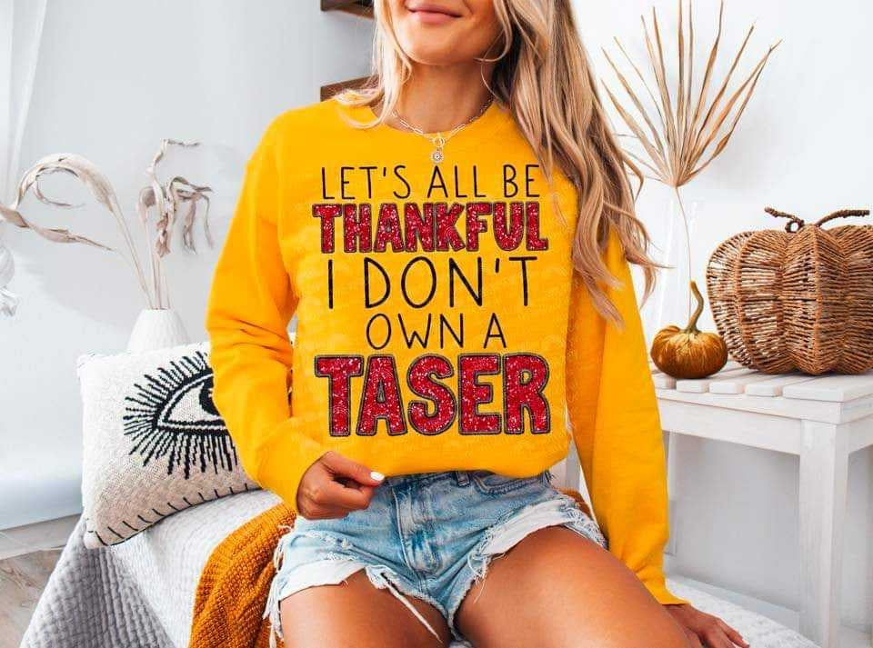 Let’s all be thankful I don’t own a taser (DDD) 62635 DTF transfer