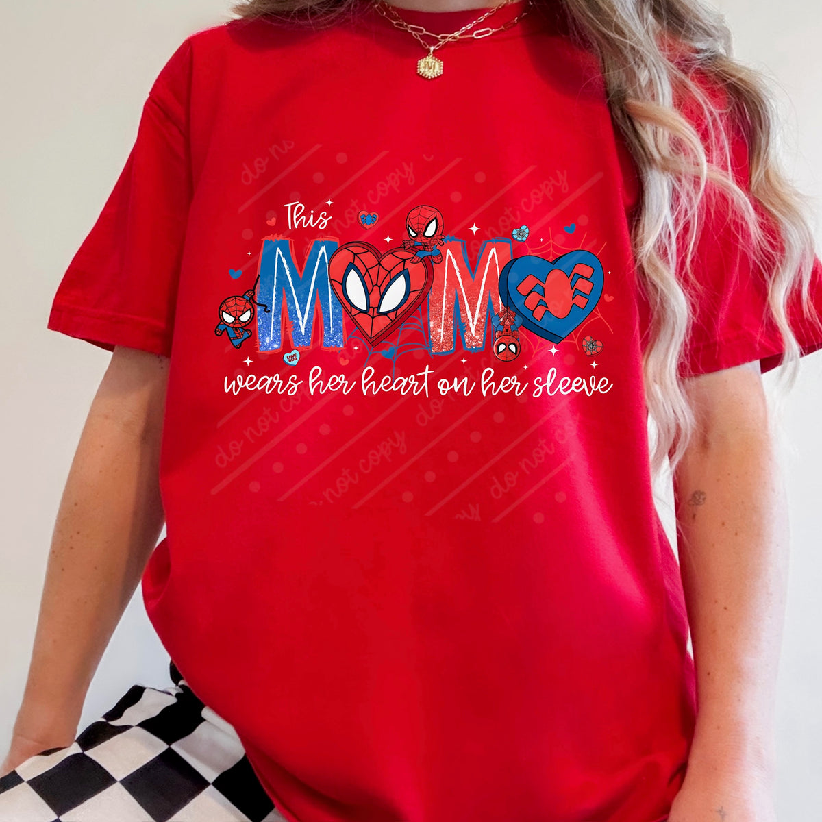 This mama wears her heart on her sleeve (white words) DTF transfer