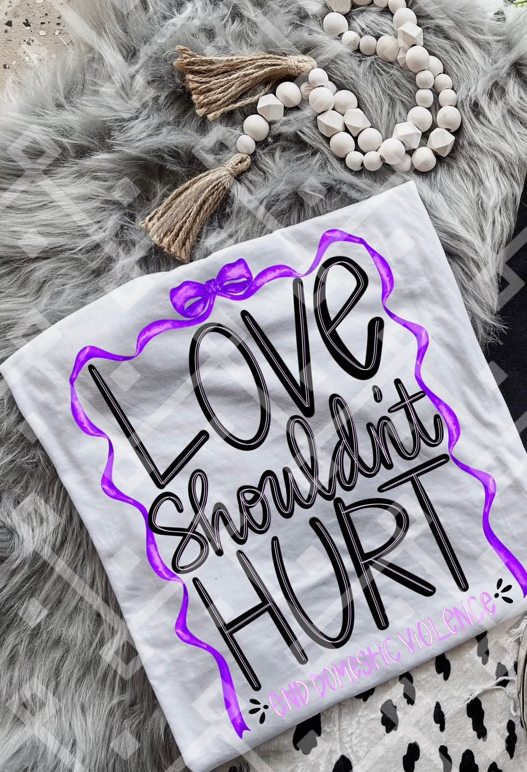 Love shouldn’t hurt purple bow black text (crafti) DTF transfer