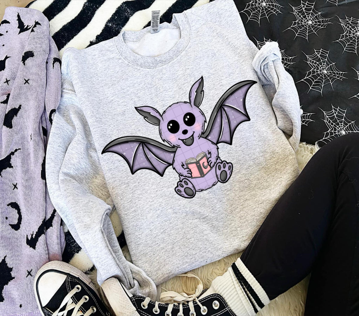 Purple Bat holding a book (linda) DTF transfer