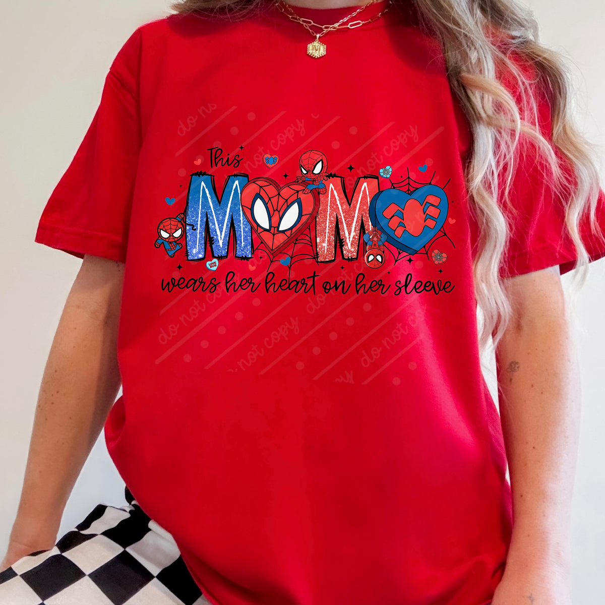 This mama wears her heart on her sleeve (black words) DTF transfer