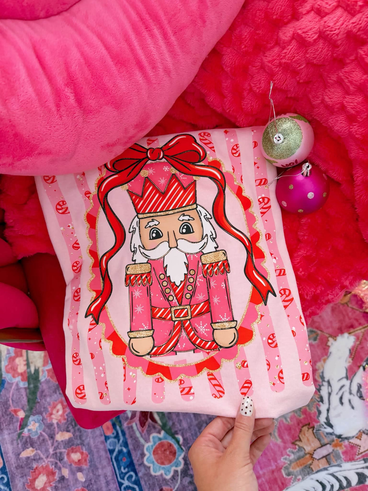 Nutcracker in red frame with candy cane stripe background (Carter) DTF Transfer