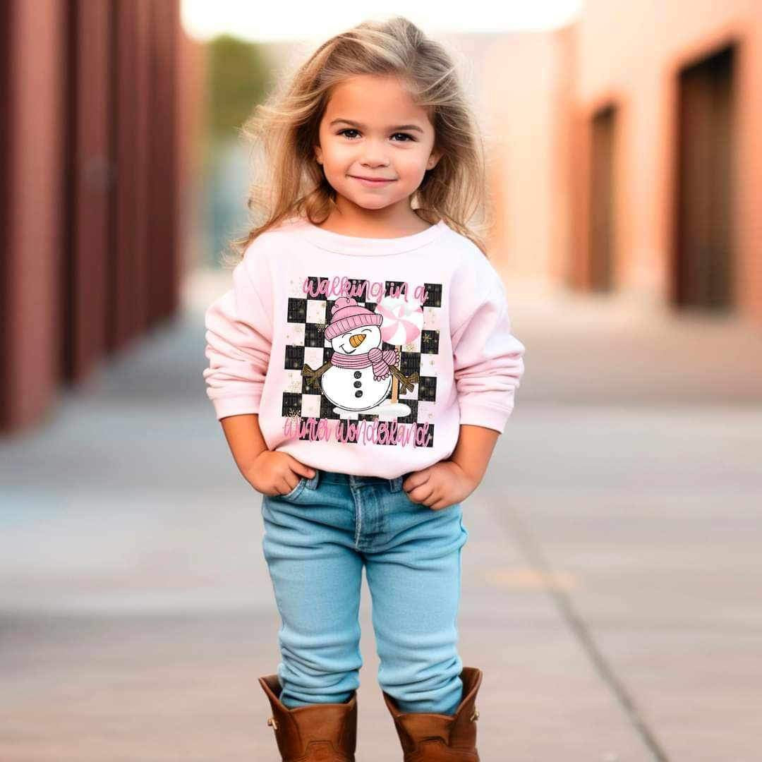 Walking in a winter wonderland (pink font and snowman with checkered background) 16621 DTF Transfer