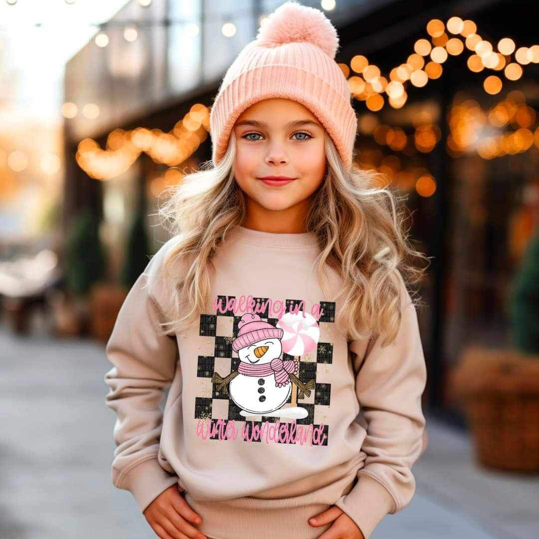 Walking in a winter wonderland (pink font and snowman with checkered background) 16621 DTF Transfer