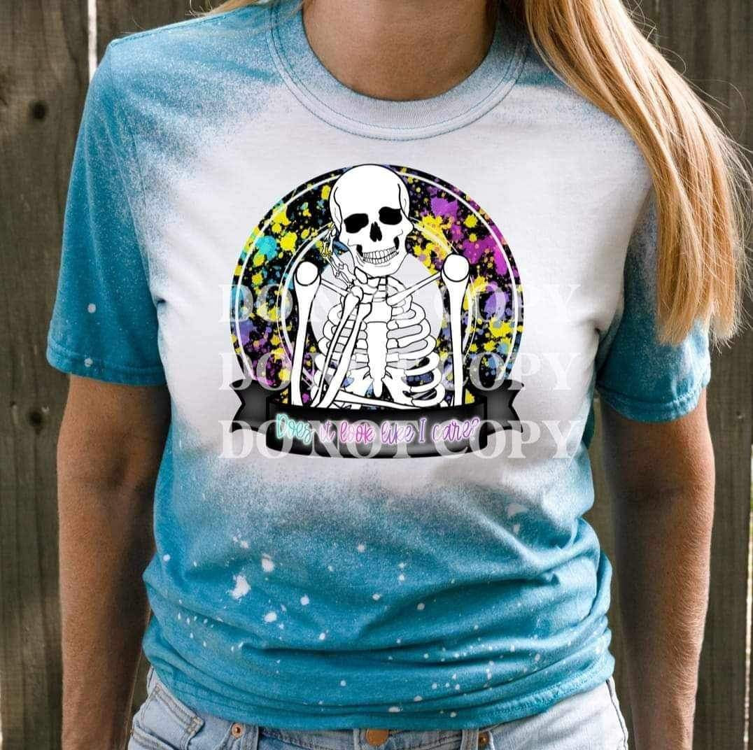 Does it look like i care (skellie and splattered background) 17020 DTF TRANSFER