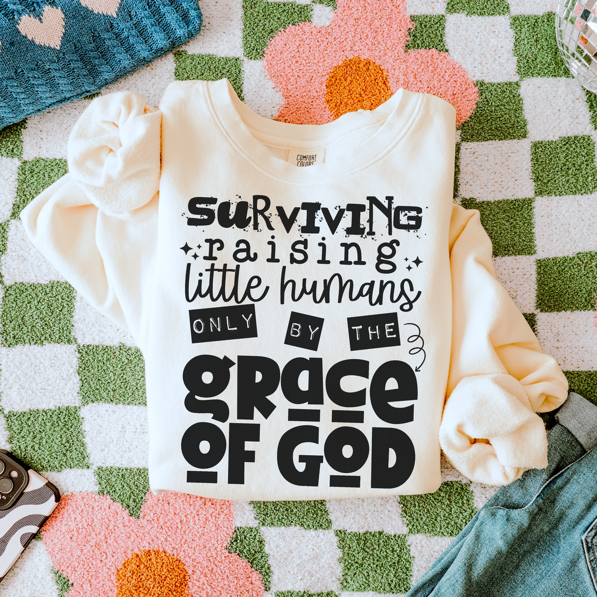 Surviving little humans by the Grace of God (black) (two peas) DTF Transfer
