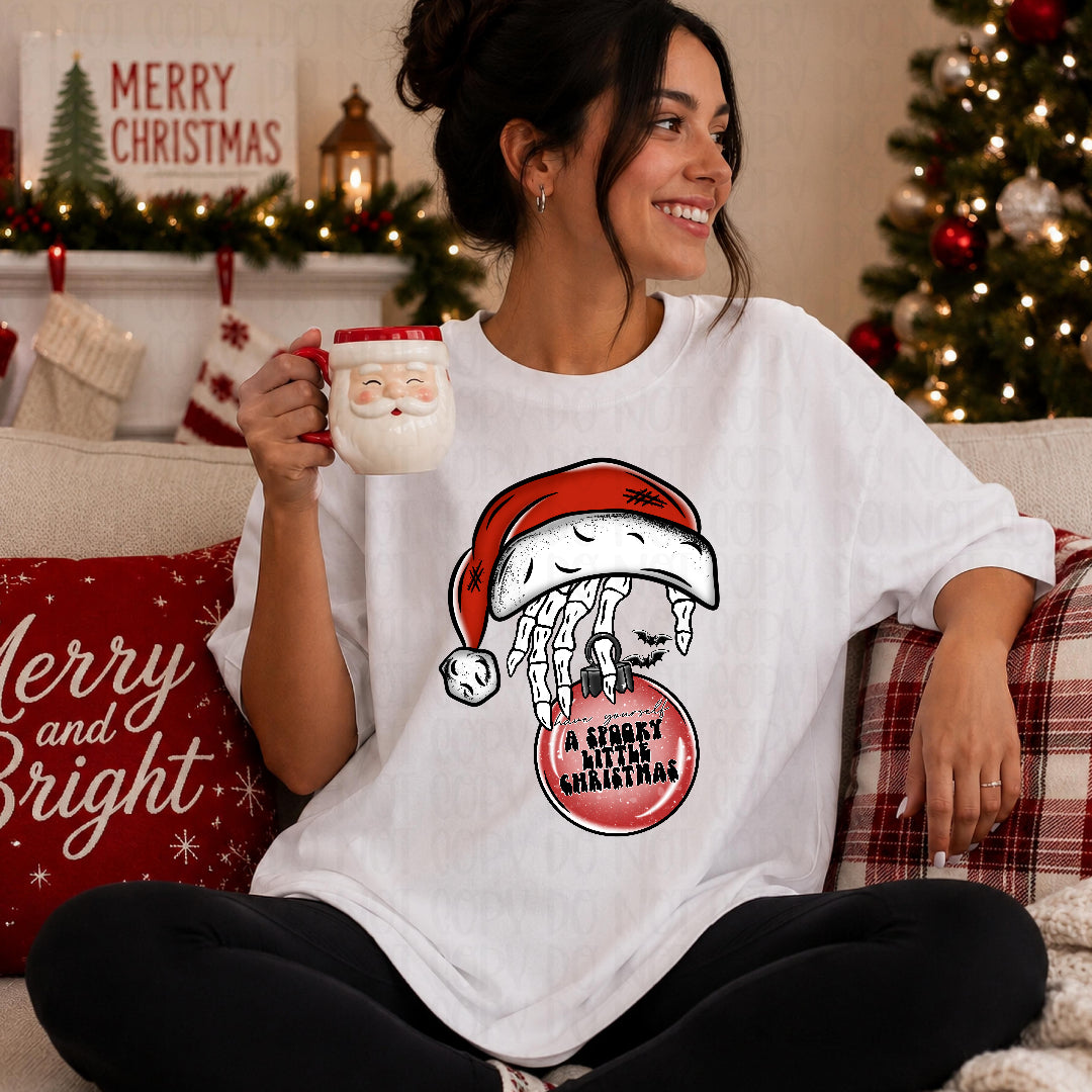 A spooky little Christmas skull hand in Santa hat (Texan) DTF transfer