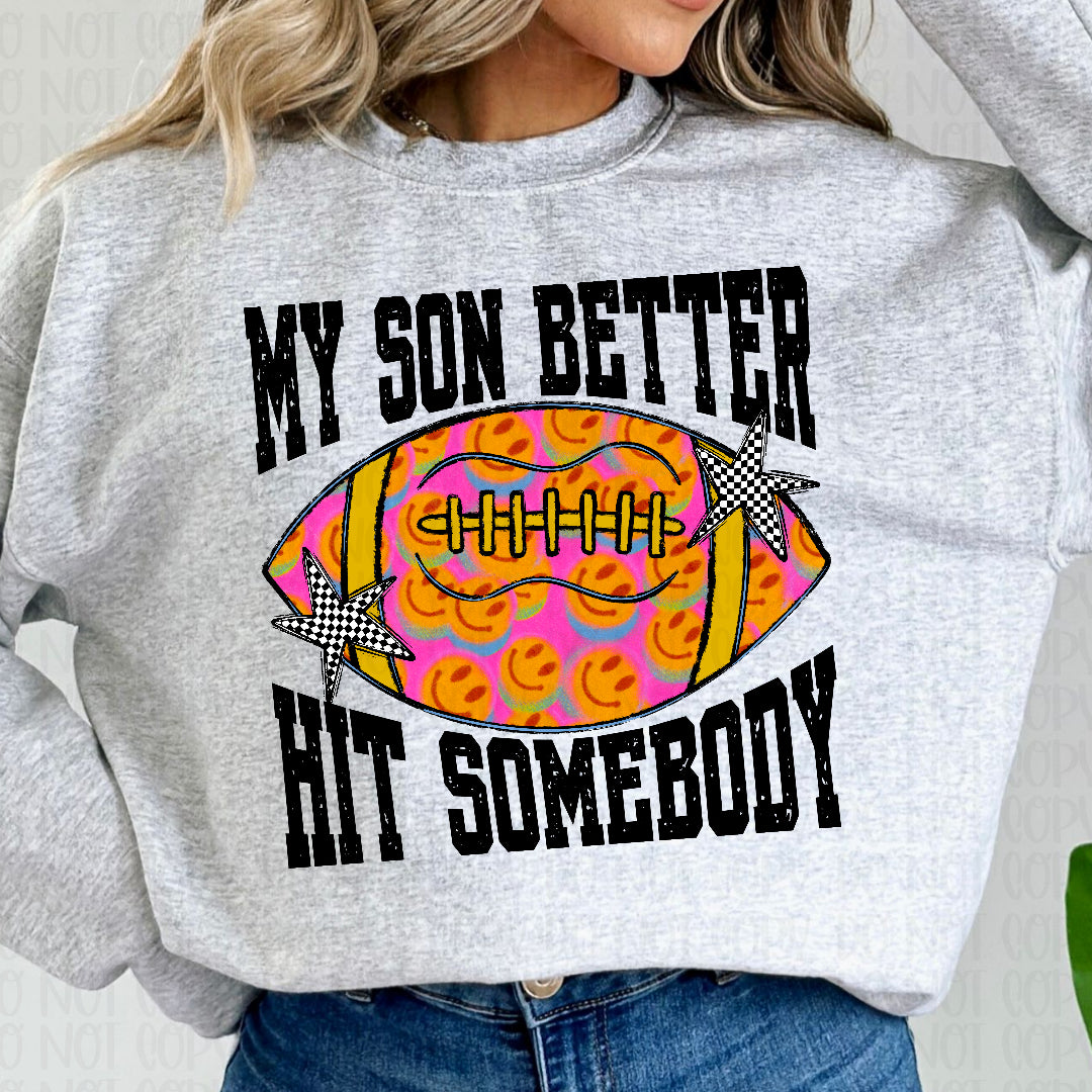 My son better hit somebody pink with yellow smiley faces football (Texan) DTF Transfer