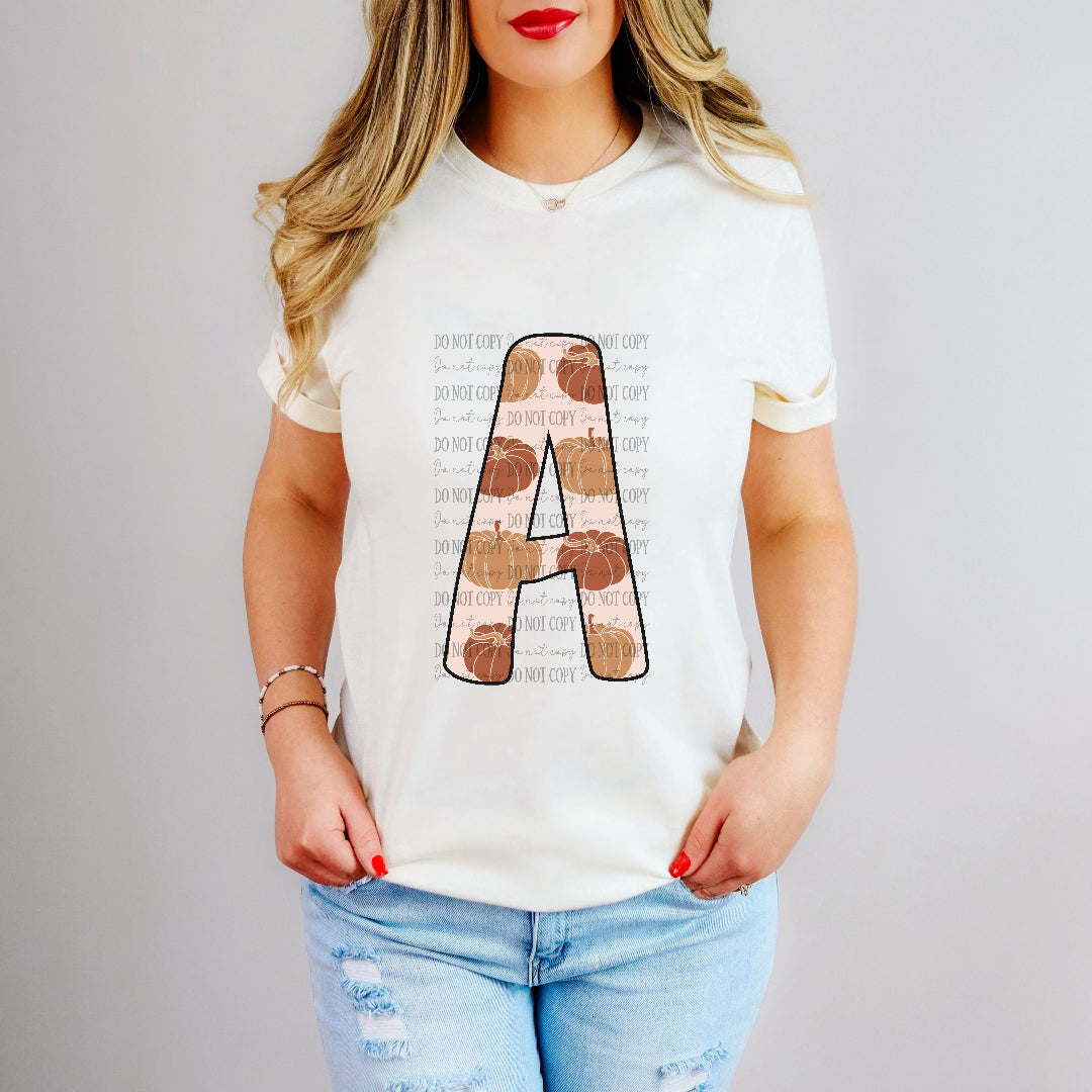 A pumpkin print font letter (dd) DTF transfer