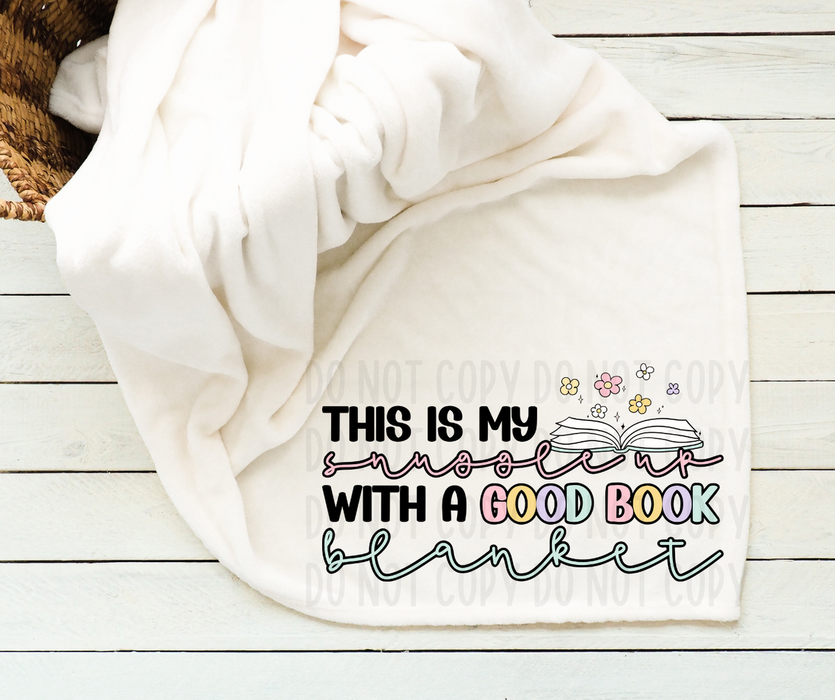This is my snuggle up with a good book blanket (canvista) DTF transfer