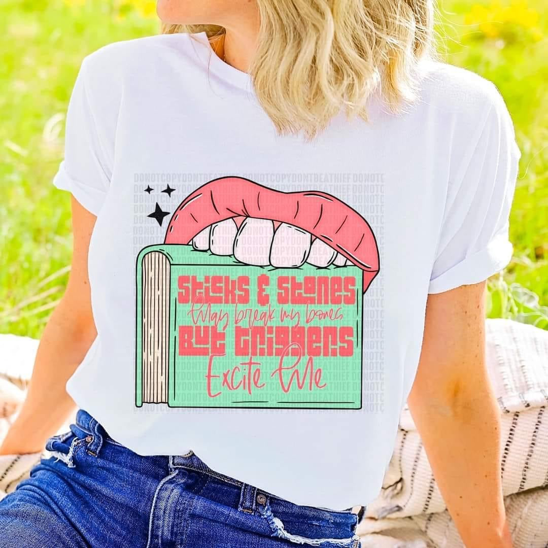 Stick and stones may break my bones but triggers excite me (lips, teeth, book with peachy colored letters) DTF TRANSFER