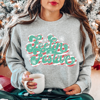 Feelin festive teal/red font with snowflakes distressed 1683 DTF TRANSFER