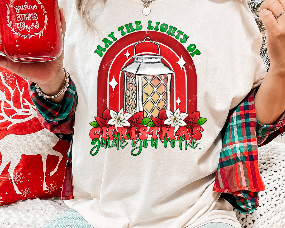 May the lights of Christmas guide you home. (lantern, poinsettias, ren arches) 1744 DTF TRANSFER