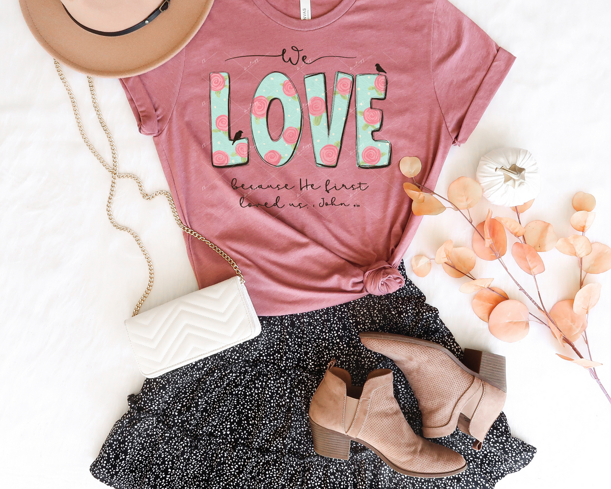 We Love because He first loved us. 1 John 4:19 (love in box lettering with light mint green and rosettes, black lettering) 1899 DTF TRANSFER