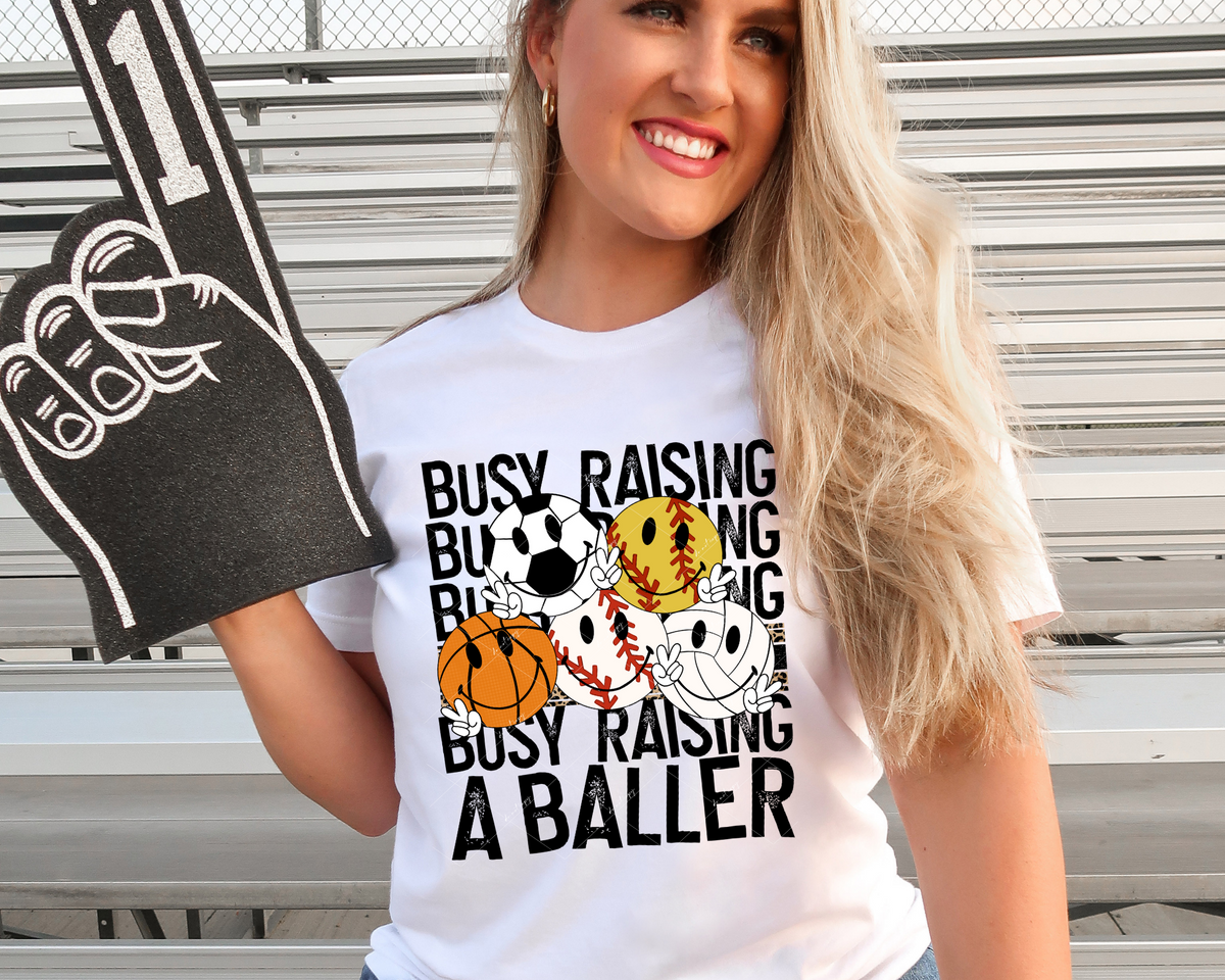 Busy Raising A Baller (sports balls, black block distressed lettering) DTF TRANSFER
