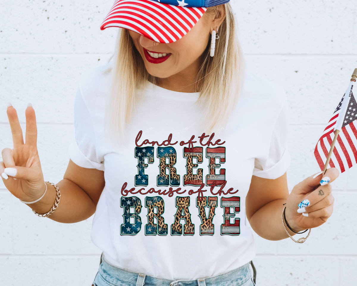 Land of the Free Because of the Brave (red handwriting, western block lettering filled with red, white, blue flag pattern with leopard print) 1662 DTF TRANSFER