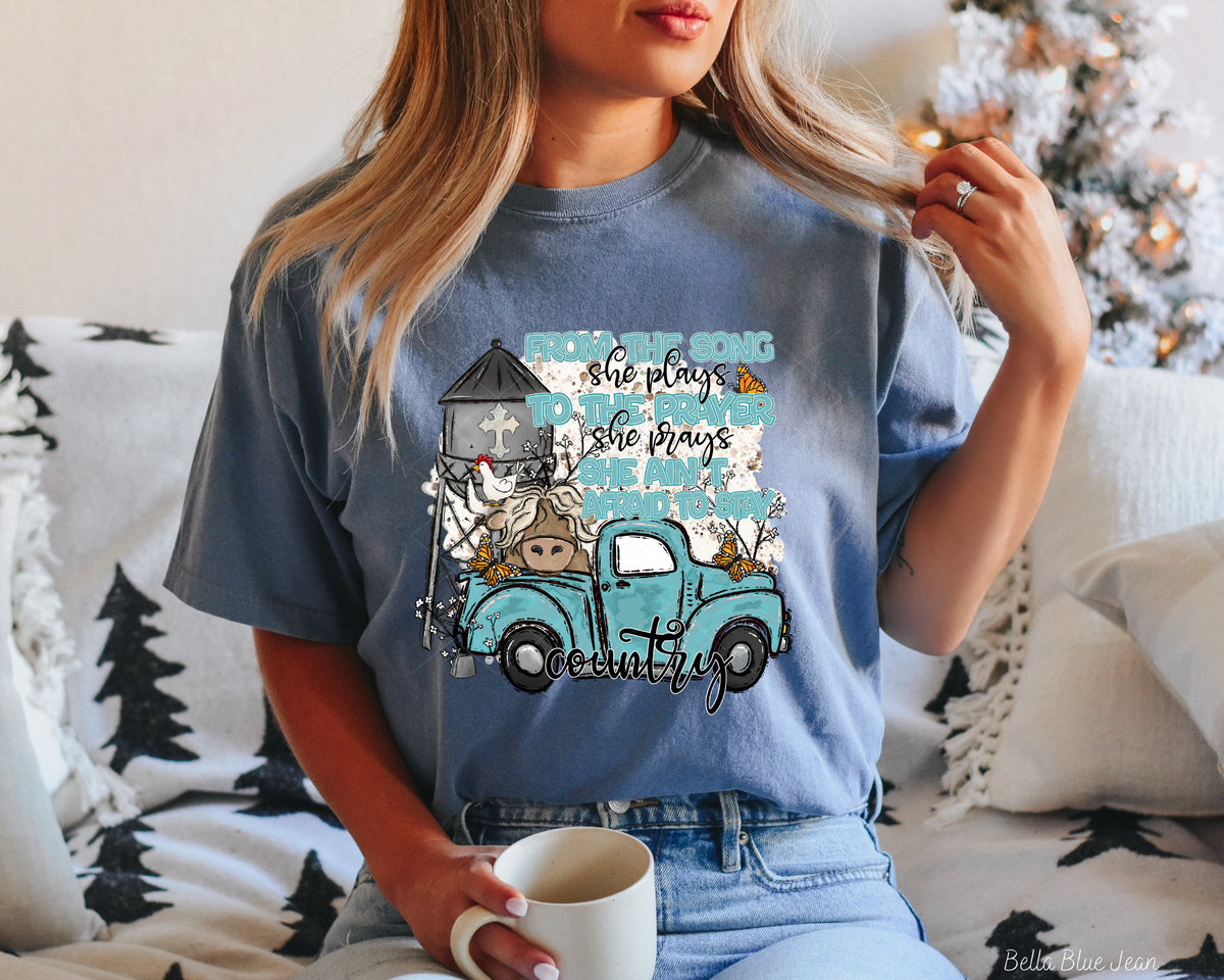 From the song she plays to the prayer she prays she ain't afraid to stay country (Blue Black Font) 112450 DTF TRANSFER