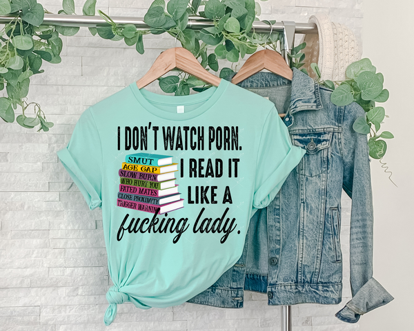 I Don't Watch Porn. I Reak It Like A Fucking Lady (stack of colorful books, black distressed lettering) 1342 DTF TRANSFER