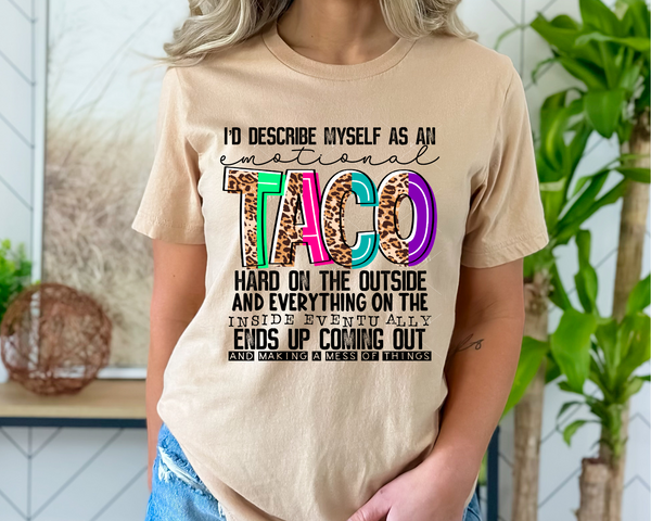 I'd describe myself as an emotional taco hard on the outside and everything on the inside eventually ends up coming out and making a mess of things (black lettering, leopard & bright color TACO lettering) 1374 DTF TRANSFER
