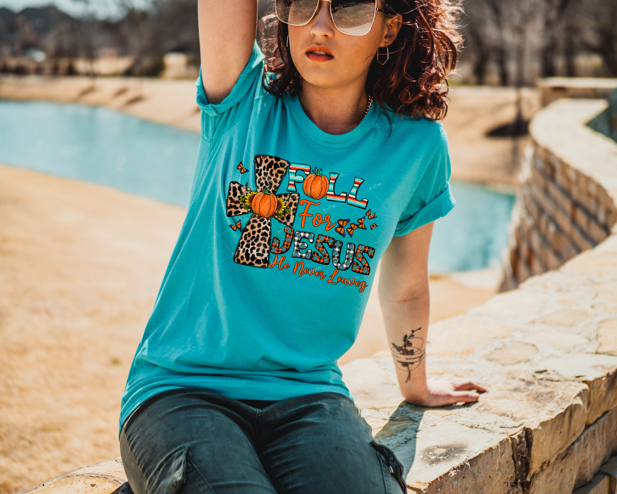 Fall For Jesus He Never Leaves (leopard print filled cross with pumpkin and sunflower center, butterflies, orange and black gingham fill in lettering, western stripe print lettering fill, Fall colors) 1386 DTF TRANSFER