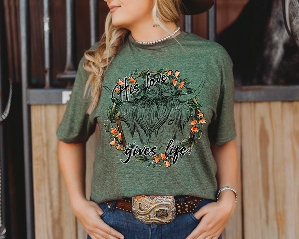 His Love Gives Life (black outlined heifer, light orange floral wreath, brown wooden cross) 8952 DTF Transfer