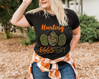 Hunting Eggspert (bright orange lettering, three camo color eggs) 1560 DTF TRANSFER