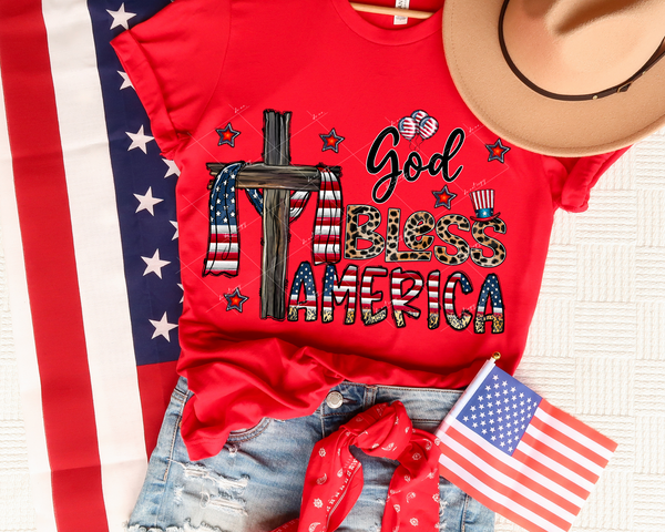 God Bless America (wooden cross draped with flag, bubble block lettering filled with leopard & red, white, blue flag, Uncle Sam hat, stars, balloons) 1448 DTF TRANSFER
