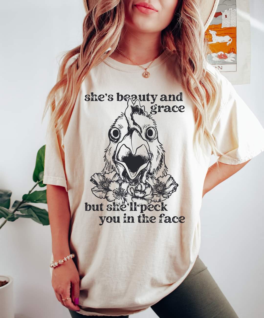 She's beauty and grace but she'll peck you in the face BLACK DTF TRANSFER