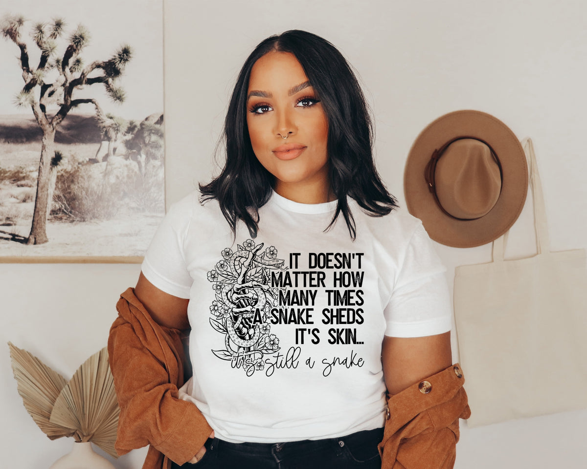 It doesn't matter how many times a snake sheds it's skin... it's still a snake BLACK screen print transfer